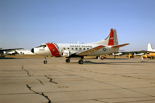 US Coast Guard Martin RM-1Z (RM-1G, VC-3A) airplane taxiing. Stationed at Coast Guard Air Detachment Arlington, Washington National Airport (Ronald Reagan Washington National Airport), Arlington, Virginia, USA. 1970. Scanned film with grain.