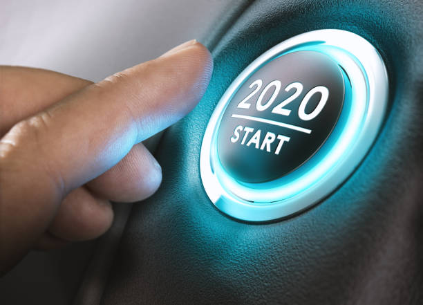 Year 2019 Start, Two Thousand Nineteen Concept. Finger about to press a car ignition button with the text 2020 start. Year two thousand and twenty concept. 2020 stock pictures, royalty-free photos & images