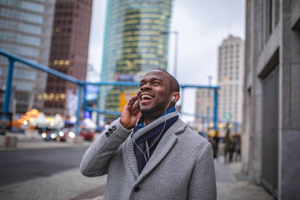 istock Handsome businessman enjoying music while on the move 1090502022