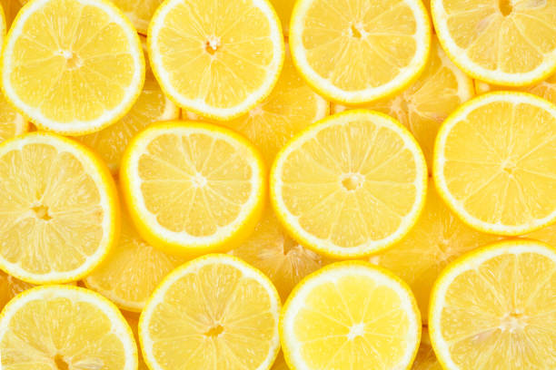 istock A slices of fresh juicy yellow lemons.  Texture background, pattern. 1090503808