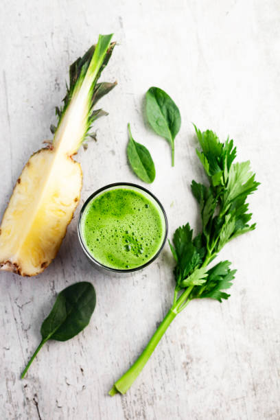 Drinking pineapple juice with celery and spinach Juice, Smoothie, Detox, Milkshake,antioxidant,pineapple juice smoothie photos stock pictures, royalty-free photos & images