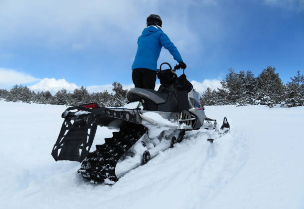 istock RIDING A SNOWMOBILE  IN A SNOW PLAIN IN WINTER 1090514822