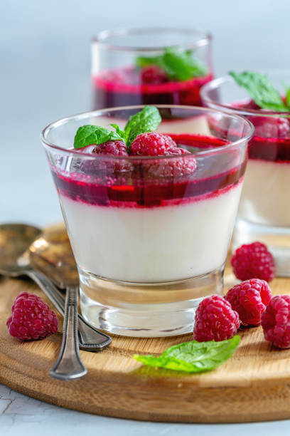 istock Vanilla Panna cotta with raspberry sauce and mint. 1090517638