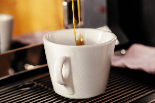 istock Professional espresso machine for brewing coffee. Coffee is poured into the Cup. The Concept Of Making Coffee In Barista Cafe 1090518444