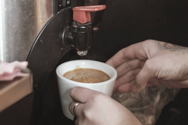 istock Professional espresso machine for brewing coffee. Coffee is poured into the Cup. The Concept Of Making Coffee In Barista Cafe 1090518510