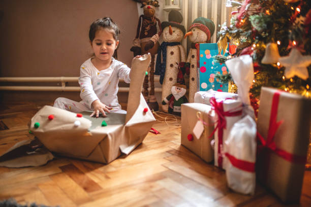 istock Excited child opening presents in the morning 1090519978