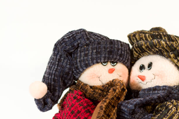 istock Cute  stuffed  snowperson couple hugging on a clean white background 1090520448