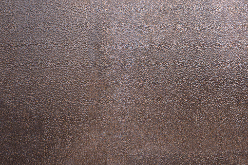 Rusty metal plate flooring with a crosshatch non-slip texture
