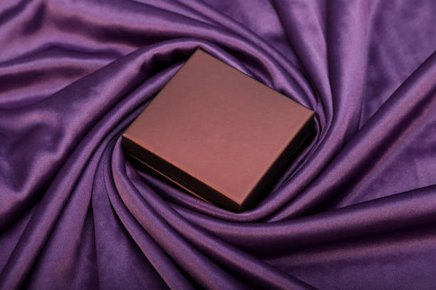 istock Blank Gift Box on a Satin Fabric for Mockups 1090526484