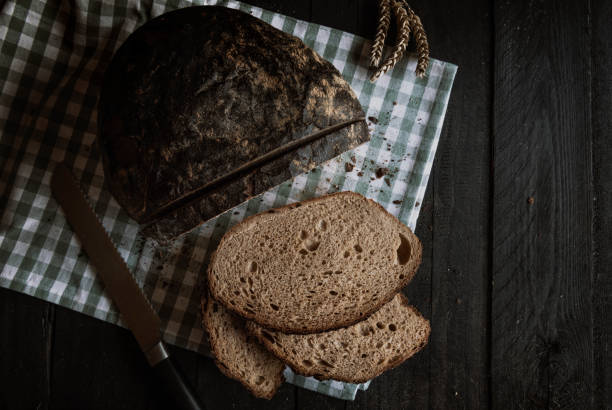 istock Brown bread on a kitchen towel above view 1090539412