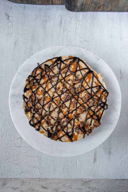 istock Caramel and chocolate drizzle peanut butter tart pie 1090543162