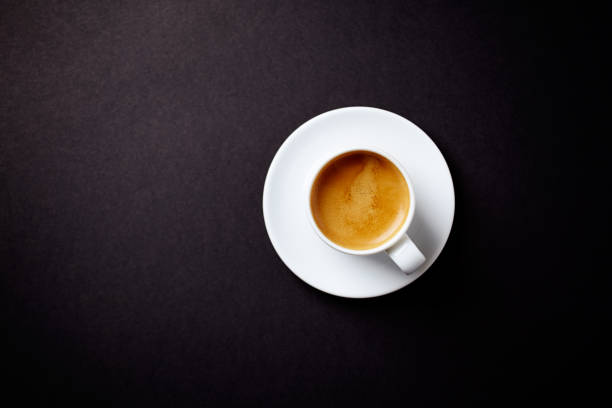 istock Cup of coffee on black background. Top view. Copy space. 1090550226