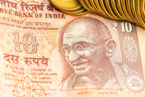 istock Indian 10 rupees banknote and 5 rupees coins. 1090550320