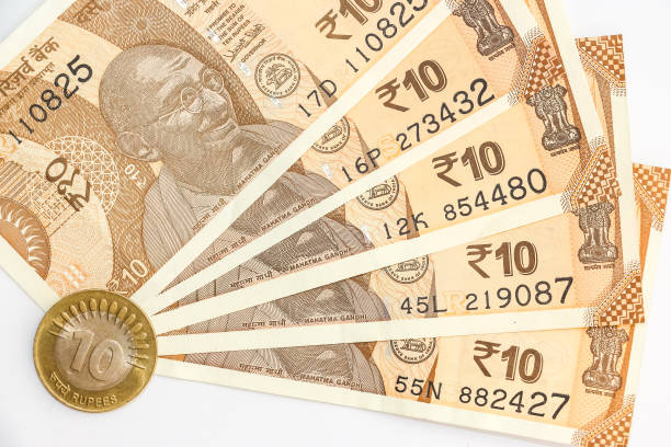 istock Indian 10 rupees banknotes and coin. 1090550328