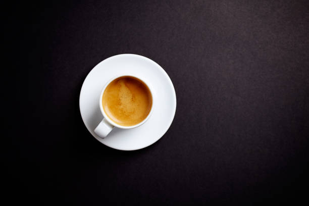 istock Cup of coffee on black background. Top view. Copy space. 1090550356