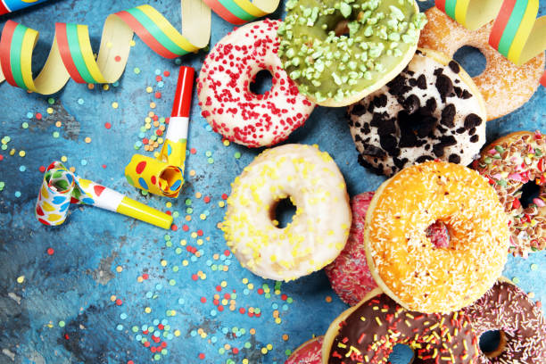 istock assorted donuts with chocolate frosted, pink glazed and sprinkles donuts 1090555102