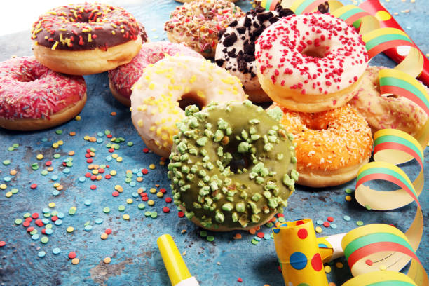 istock assorted donuts with chocolate frosted, pink glazed and sprinkles donuts 1090555578