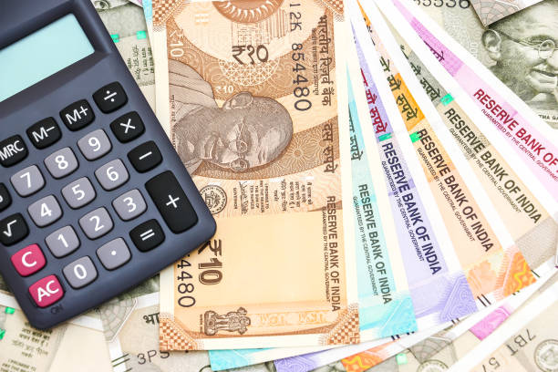 istock Calculator over new indian 10, 50, 100, 200, 500 and 2000 rupees banknotes. 1090557250