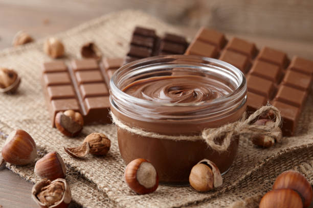 istock Chocolate spread with hazelnuts on wooden background 1090560870