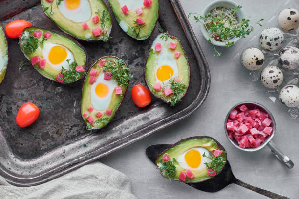 istock Keto diet dish: Avocado boats with ham cubes, quail eggs and cherry tomatoes 1090561194