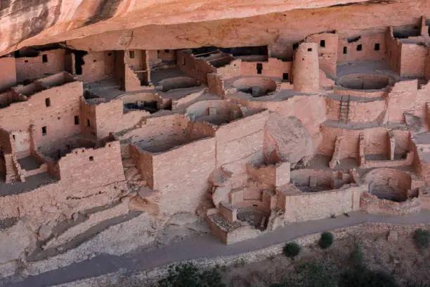 Mesa Verde National Park is in southwest Colorado. It's known for its well-preserved Ancestral Puebloan cliff dwellings, notably the huge Cliff Palace. The Chapin Mesa Archeological Museum has exhibits on the ancient Native American culture. Mesa Top Loop Road winds past archaeological sites and overlooks, including Sun Point Overlook with panoramic canyon views. Petroglyph Point Trail has several rock carvings.