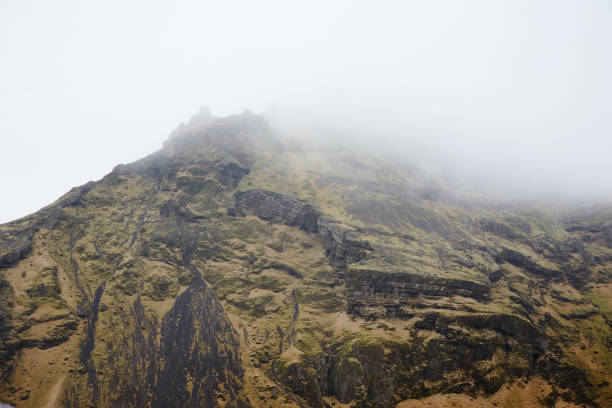 istock Mountain peaks covered with moss in the fog 1090565042