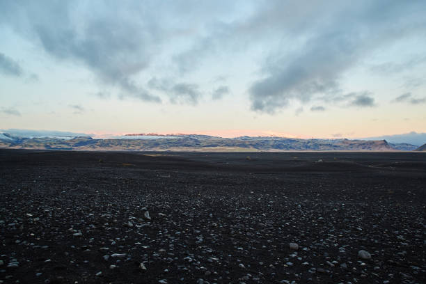 istock Icelandic Sunset over mountain black stones in foreground 1090565144