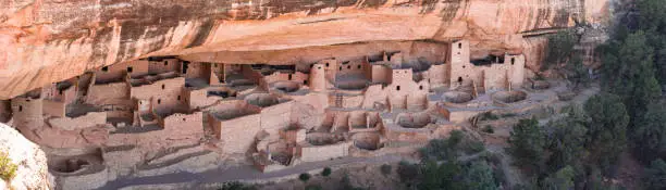 Mesa Verde National Park is in southwest Colorado. It's known for its well-preserved Ancestral Puebloan cliff dwellings, notably the huge Cliff Palace. The Chapin Mesa Archeological Museum has exhibits on the ancient Native American culture. Mesa Top Loop Road winds past archaeological sites and overlooks, including Sun Point Overlook with panoramic canyon views. Petroglyph Point Trail has several rock carvings.