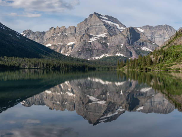 istock Mountains Reflecting In Lake Josephine 1090569668