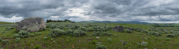 istock Panorama of Large Boulder in Front of Wyoming Wilderness 1090569718