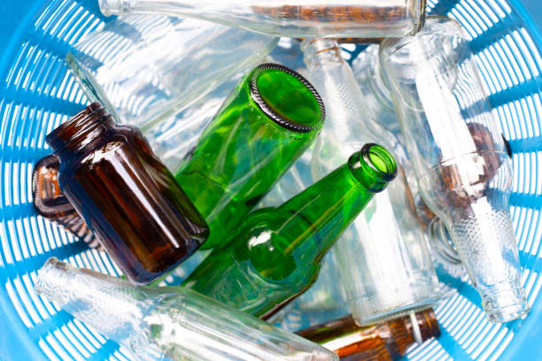 istock Glass bottles in waste basket. 1090572422