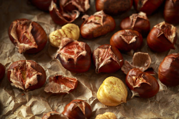 istock Roasted shell chestnuts served on crumpled paper 1090572934