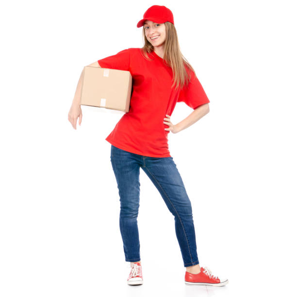 istock Delivery woman in red uniform holding box package 1090574752