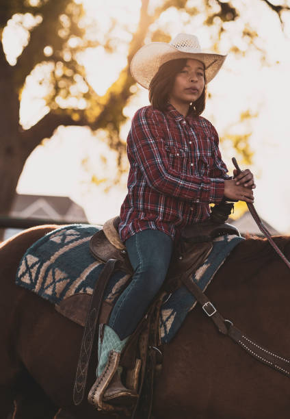 istock A young girl horseback riding by herself. 1090581604
