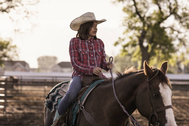 istock A young girl horseback riding by herself. 1090581618