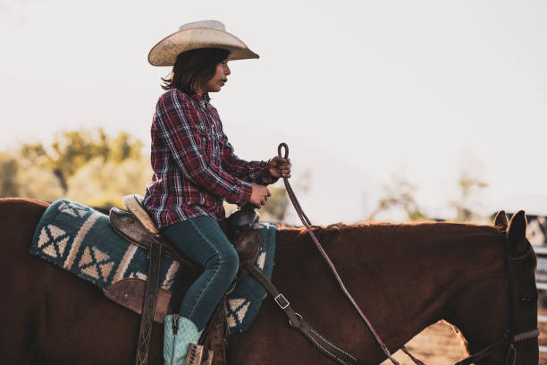 istock A young girl horseback riding by herself. 1090581636