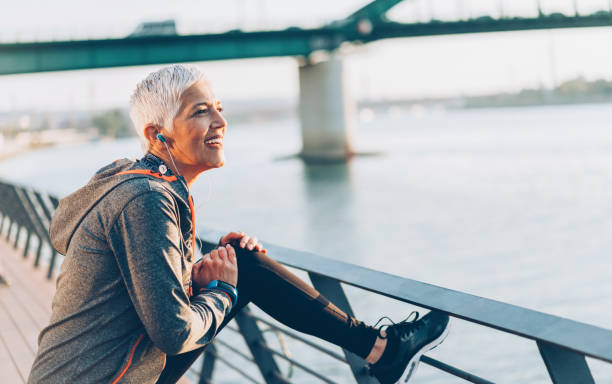 istock Joyful senior woman stretching 1090581872
