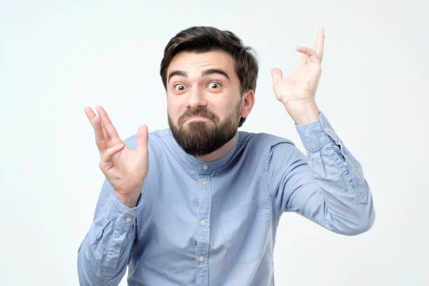 istock Young hispanic man with beard wearing blue shirt making a joke. 1090581978