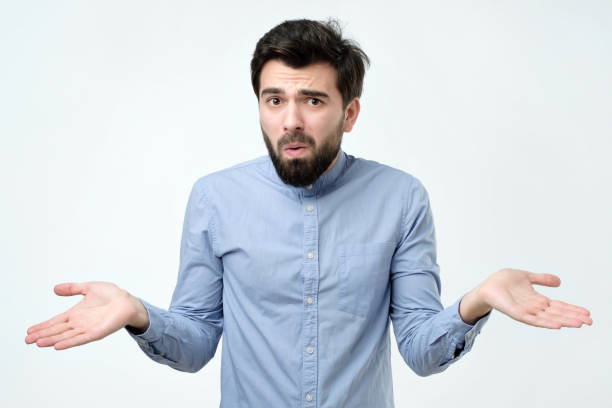 istock Hispanic man in blue shirt throws up his hands in disbelief 1090589430