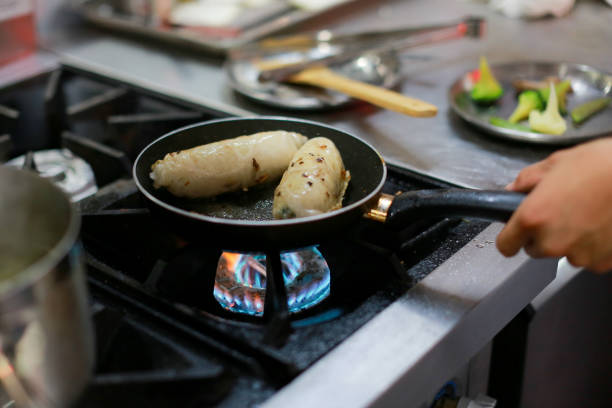 istock Chef cooking food in the kitchen, Chef preparing food 1090589796