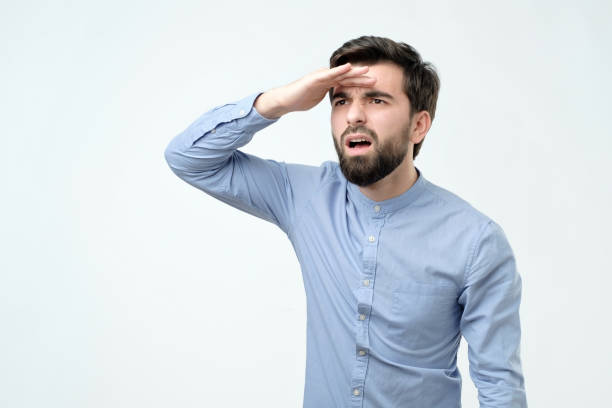 istock confused young hispanic man with beard looking far away 1090590352