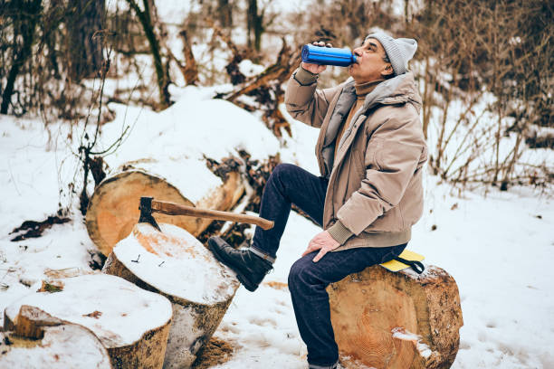 istock Senior man drinking water in a personal lumber yard 1090590718