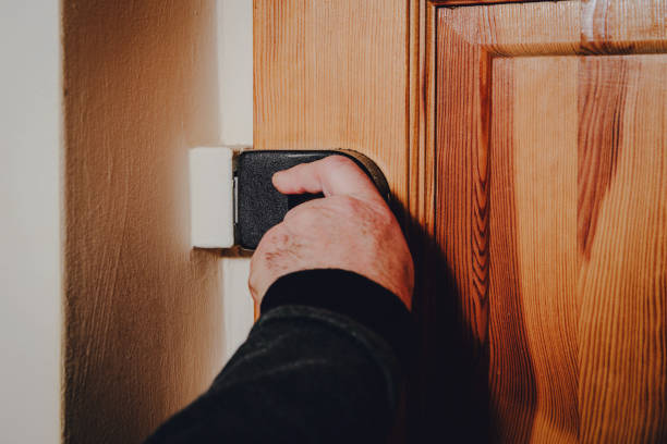 istock Closing the door with a lock, key, protecting your own home. 1090597186