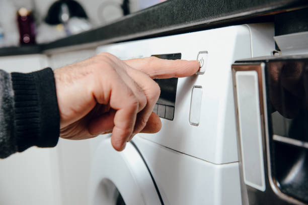 istock Turning the button on from the washing machine. 1090598418