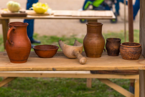istock Traditional rustic pottery on a wooden bench 1090599214