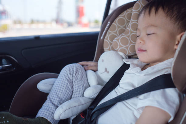 cute little asian 2 - 3 years toddler baby boy child sleeping in modern car seat - 2 3 years fotos imagens e fotografias de stock