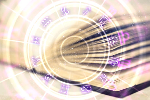 Creative book with zodiac wheel Close up of creative book with zodiac wheel. Magic and astrology concept. Double exposure cosmos of the stars of the constellation capricorn and gems stock pictures, royalty-free photos & images