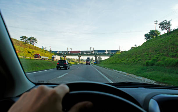 First person view driving at the highway Brazilian highway country side of São Paulo car point of view stock pictures, royalty-free photos & images