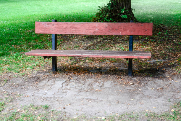 istock A rustic bench painted blue and red in a public square 1090605788