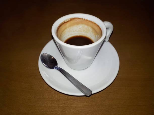 istock A white cup of coffee over a saucer with a teaspoon beside it 1090605842